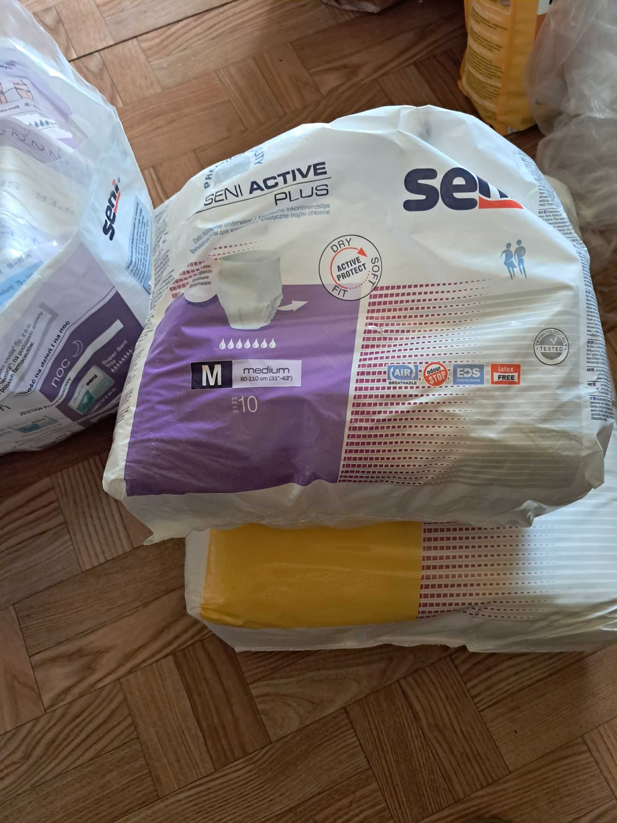 Pampersy, pieluchomajtki, wkłady do pampersów i podkłady.