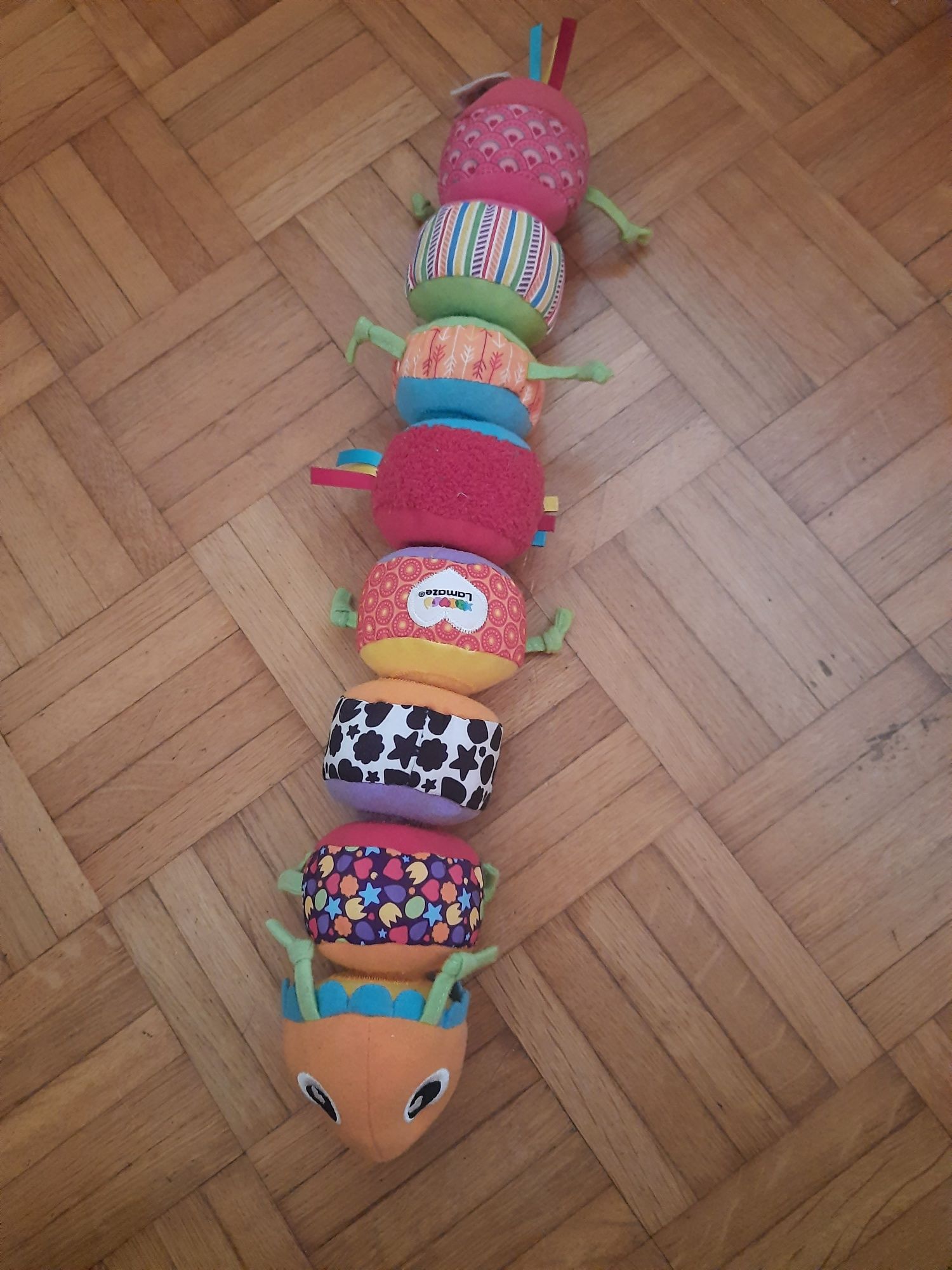 Tomy Lamaze gąsienica sensoryczna mix and mach