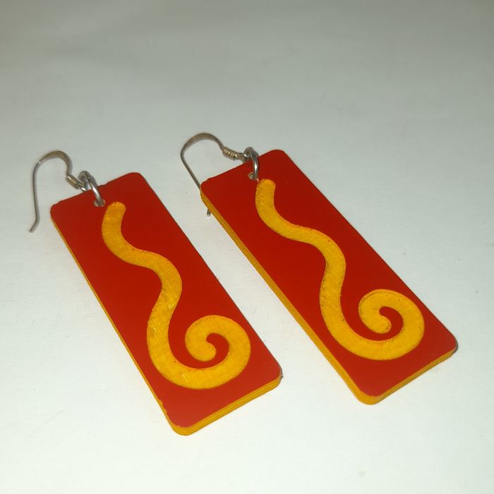 Wooden earrings in the shape of spirals.