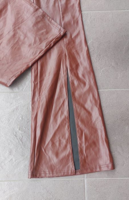 Spodnie skórzane eko skóra latex szerokie nogawki rozcięcia S 36 Nowe