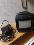 Tv portatil com antena e carregador 22ow