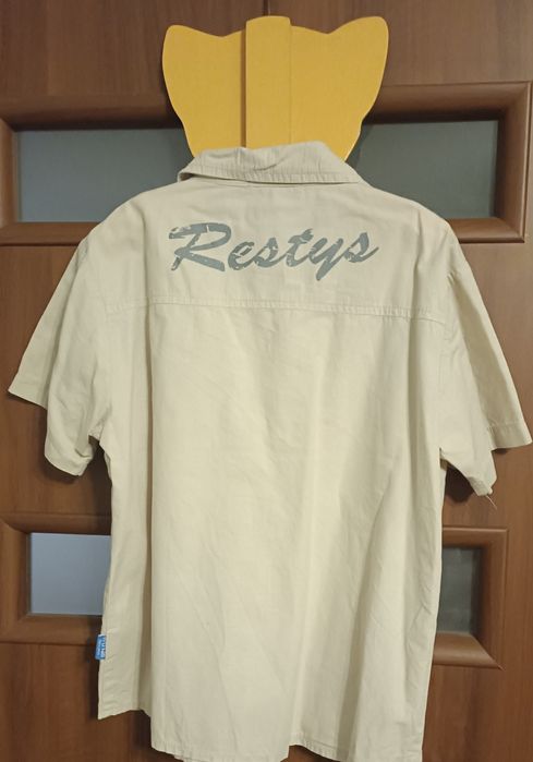 Koszula chłopieńca z krótkim rękawkiem firmy Restys.