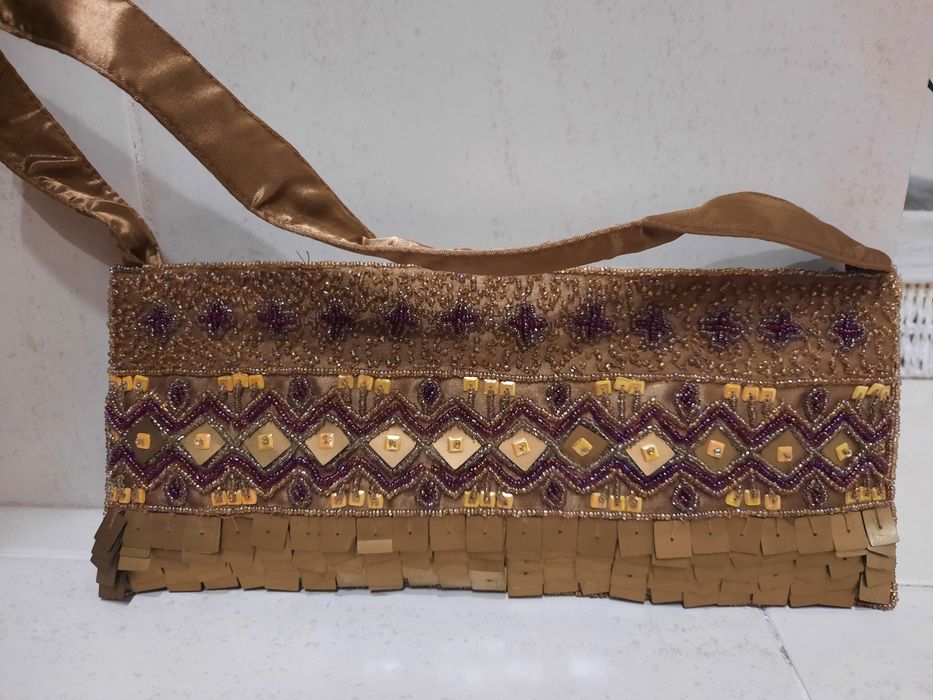 Mules Haity e clutch.