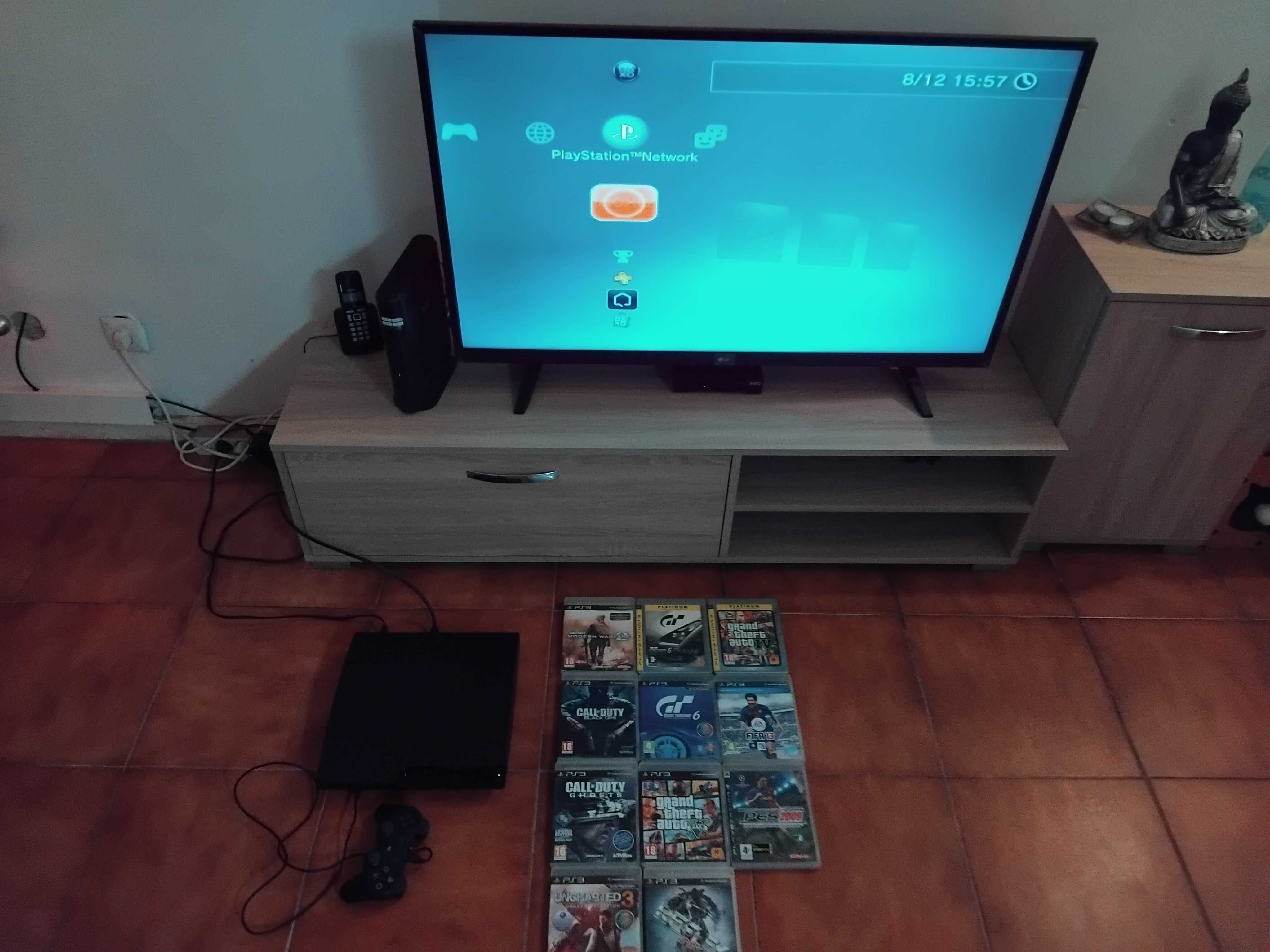 PS3 com jogos e comando