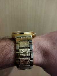 Relógio Swatch dourado