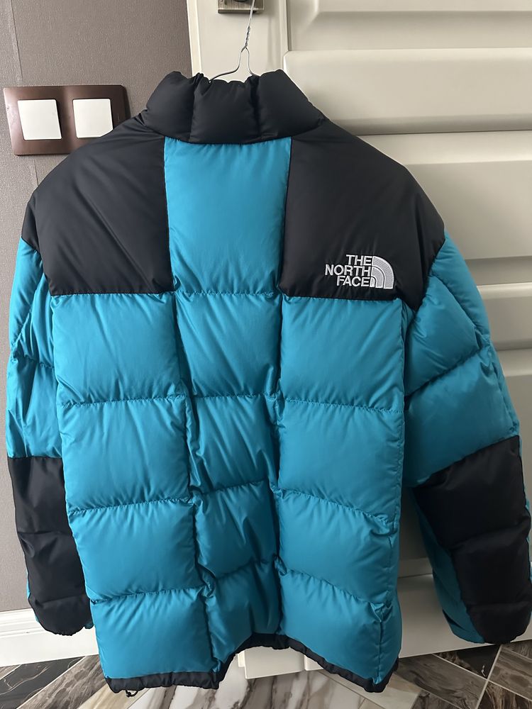 The North Face пуховик синий