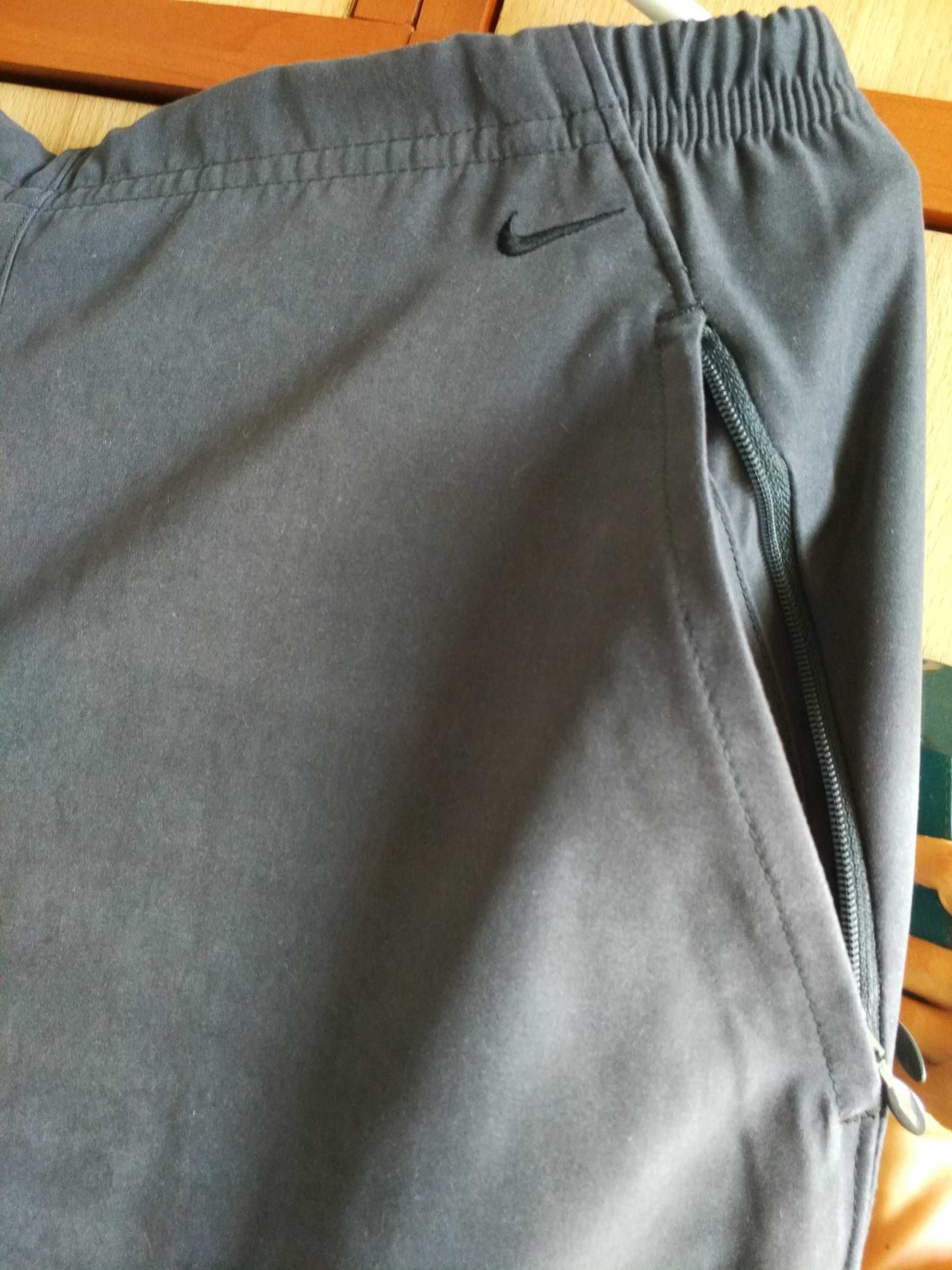 Eleganckie spodnie dresowe Nike lekkie cienkie kolor grafitowy r 38