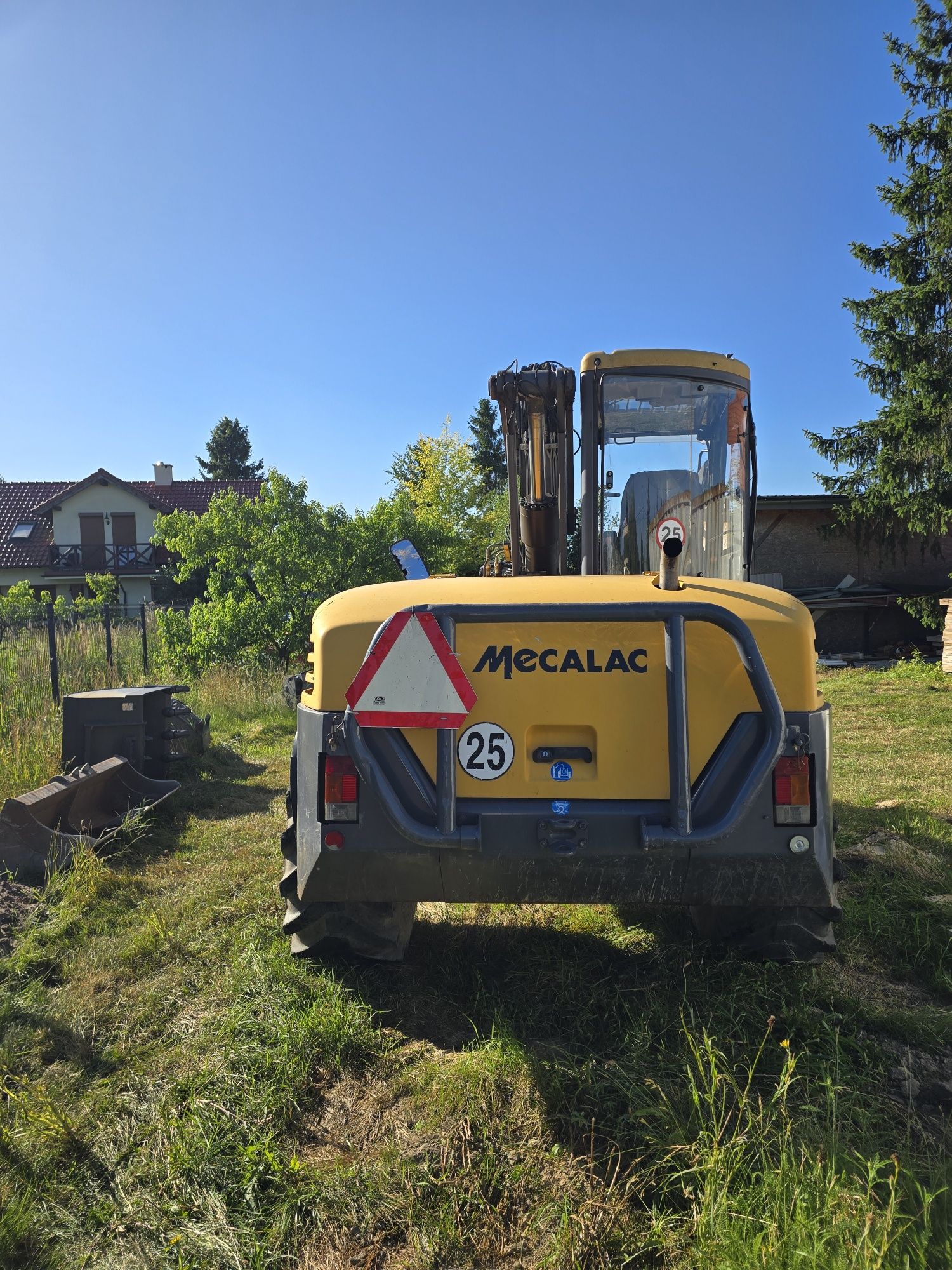 Koparko-ładowarka typu  Mecalac 12
