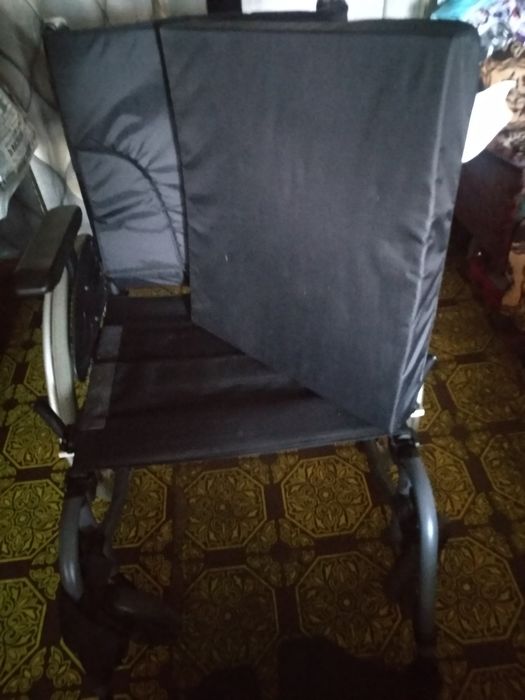 Инвалидная коляска.
