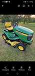 Traktorek John Deere X320 Zachód.