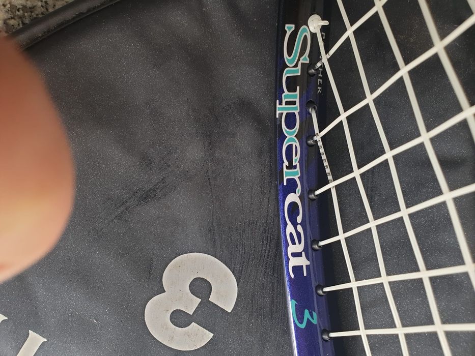 Raquete de tennis
