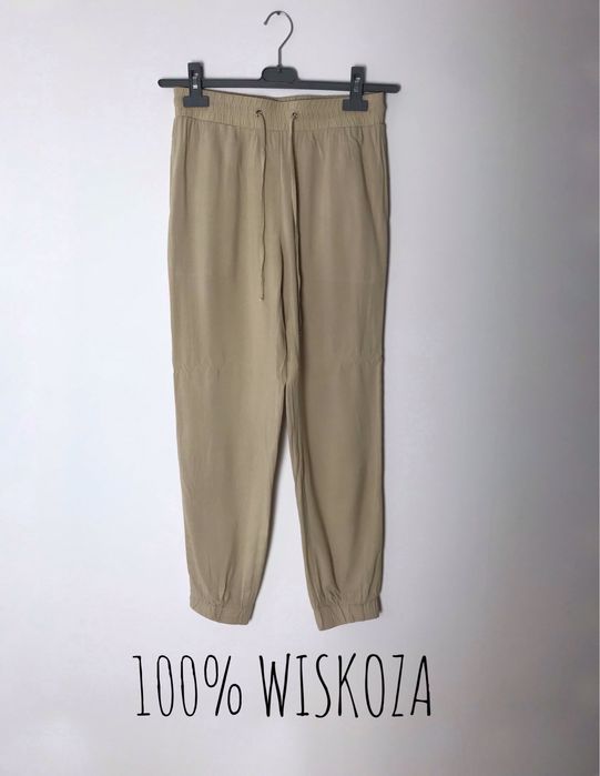 Beżowe długie wiskozowe spodnie z wysokim stanem, joggery na lato