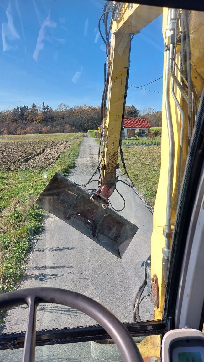 Wynajem koparki kołowej NEW HOLLAND MH 2.6 wypożyczenie koparki 10Ton