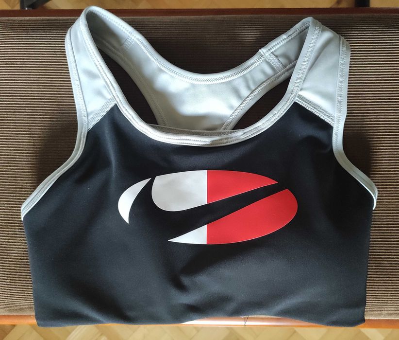 Damski stanik sportowy Nike w kontrastowych kolorach, rozm. XS