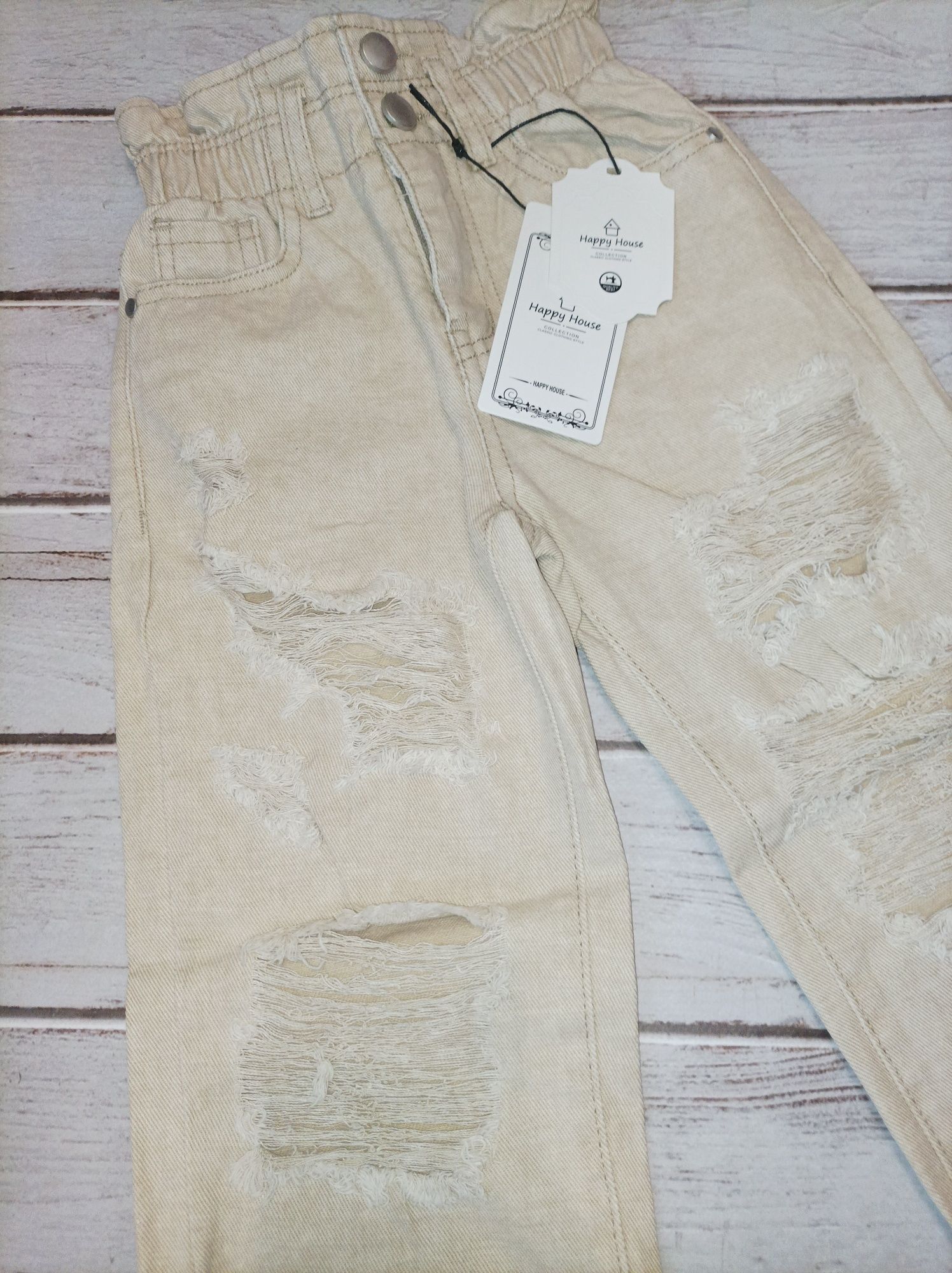 Spodnie jeansowe z przetarciami 146 152