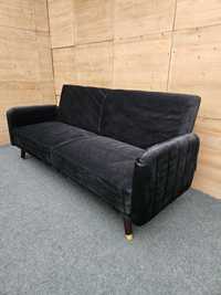 Czarna welurowa sofa z rozkładanym oparciem