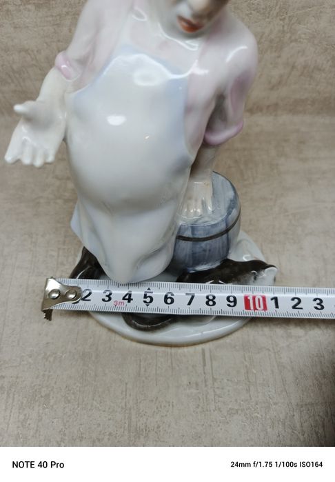Łomonosow, porcelanowa figurka kota i kucharza.