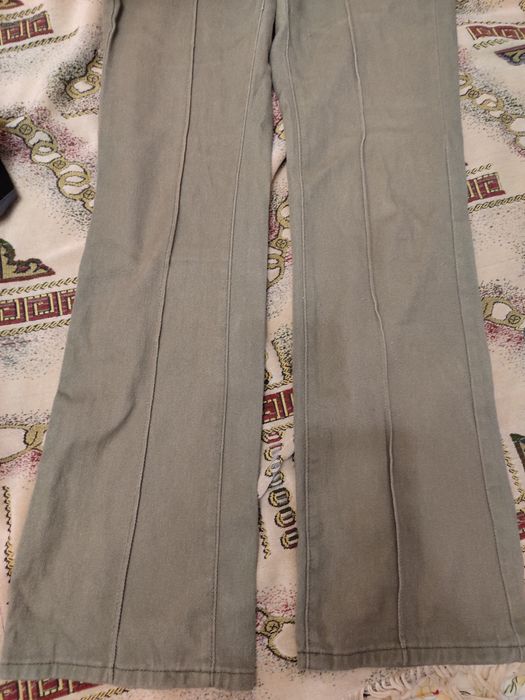 Оливкові клеш штани