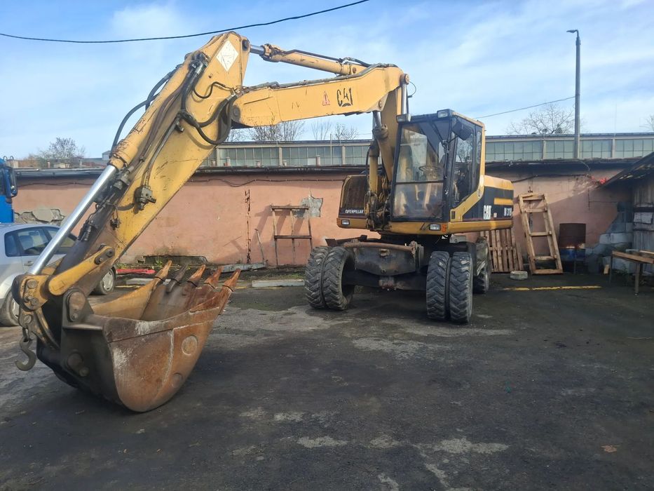 Caterpillar CAT M318  Koparka kołowa CAT M318