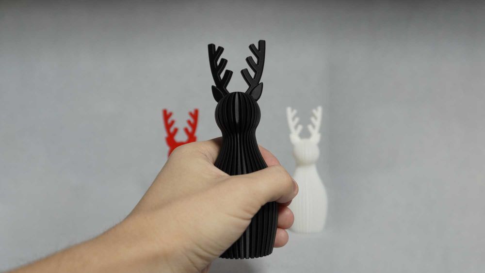 Набір з 3 новорічних фігурок оленів (чорний, білий, червоний)