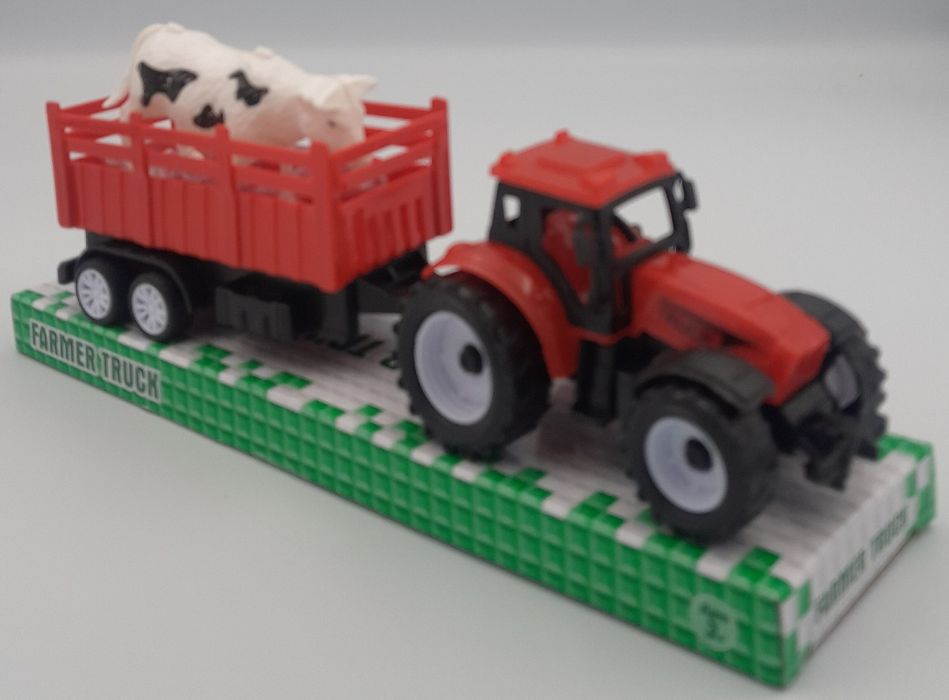 Traktor / traktorek / ciagnik z krowa na przyczepie