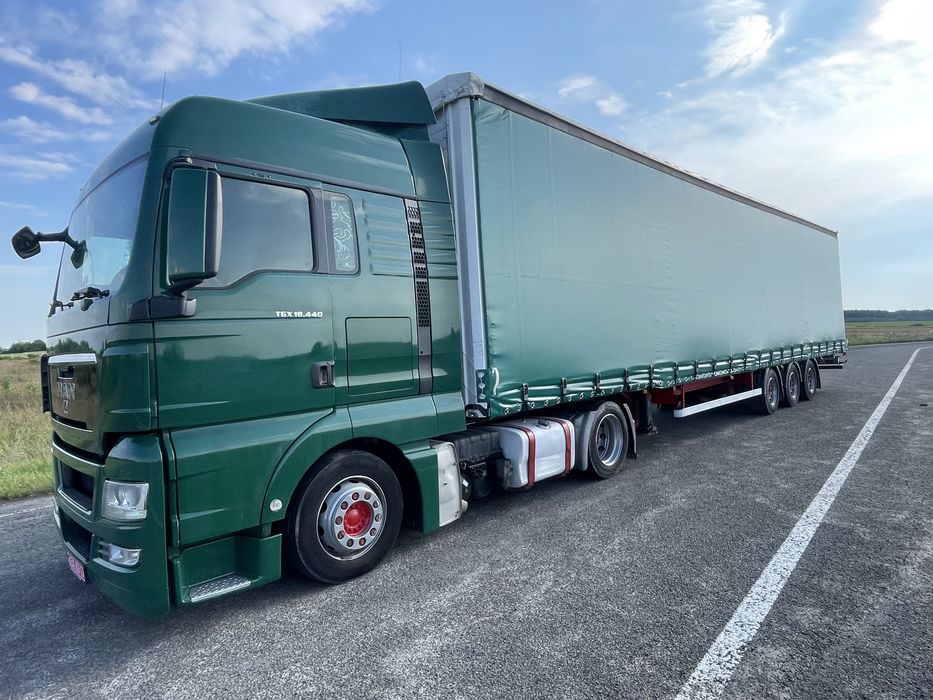 Тягач Man TGX 18.440 MEGA + напівпричіп штора Kassbohrer осі SAF