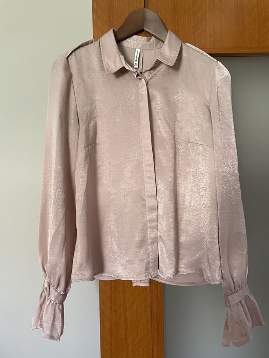 Camisa sedosa rosa de senhora