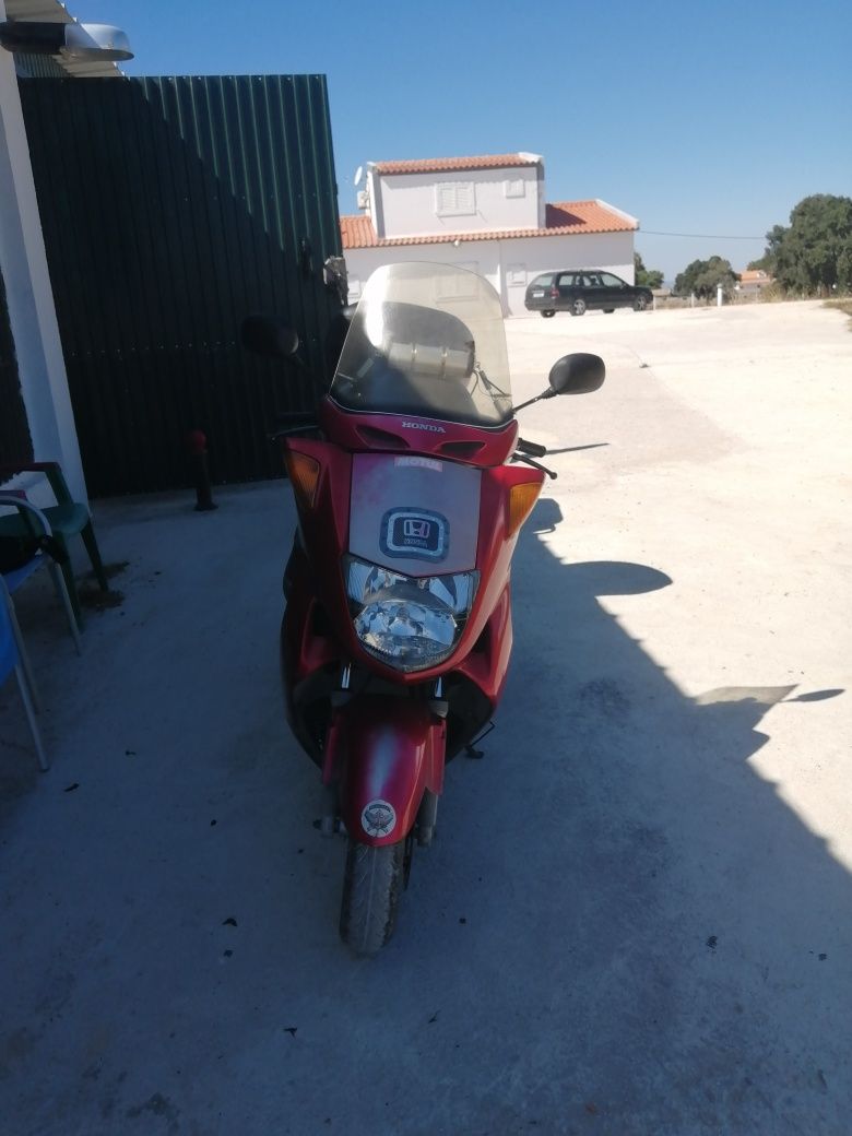 Honda 250 com reboque