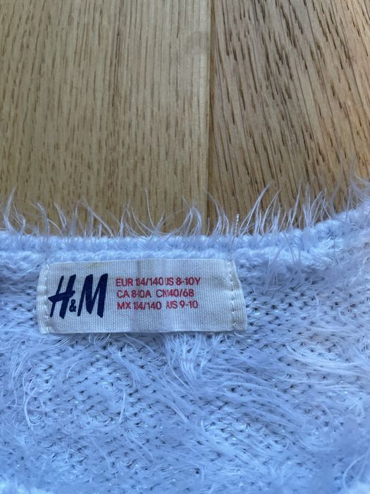 Jasnoniebieski polyskujacy sweterek H&M