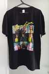 T Shirt nova, de manga curta, preta com figuras à frente