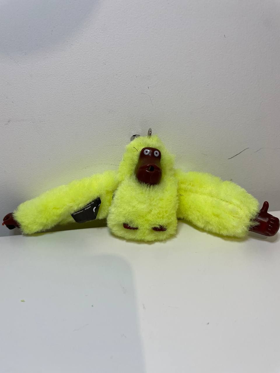 Żółty breloczek kipling małpa .