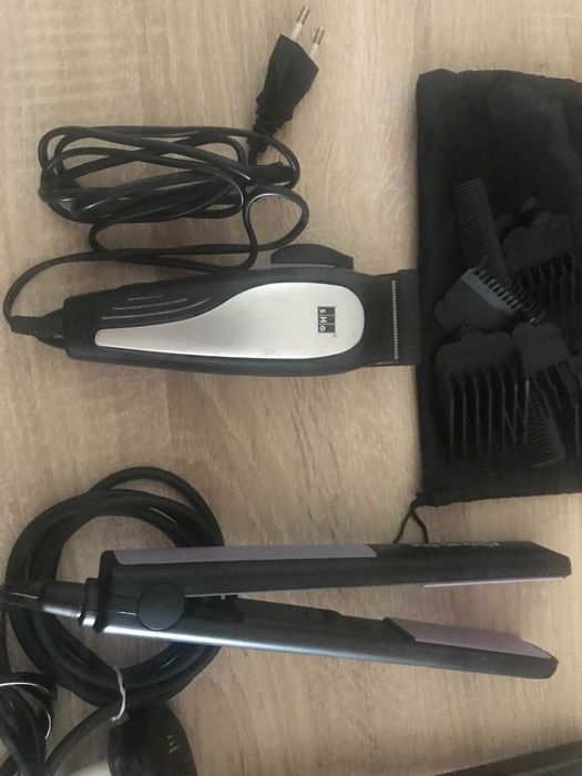 dois alisadores um secador e uma maquina de cortar cabelo usados