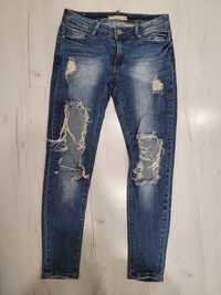 spodnie jeansy z dziurami