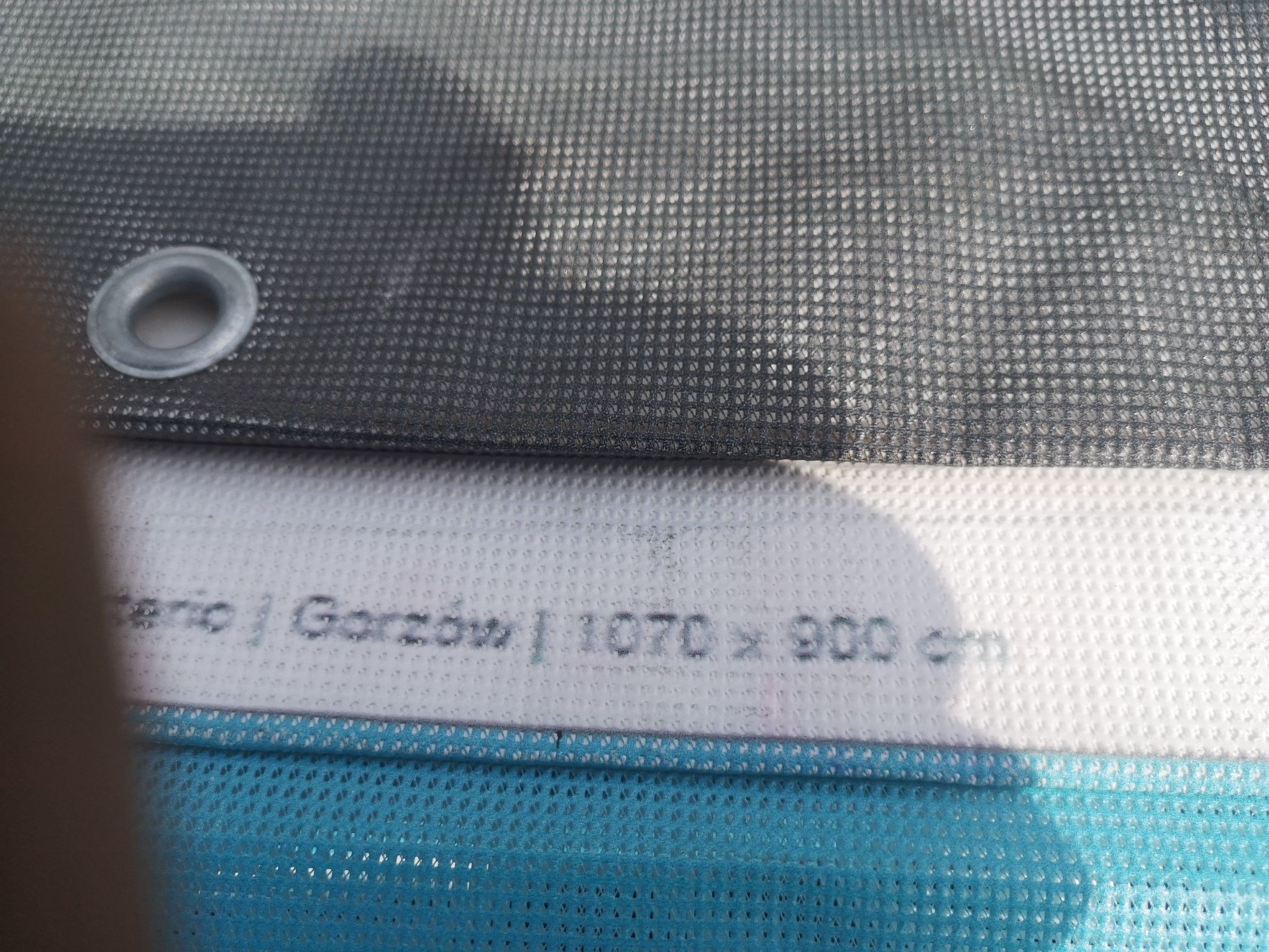 Plandeka dziurkowana 6,30x5,10 przemakalna na przykrycie basenu itp.