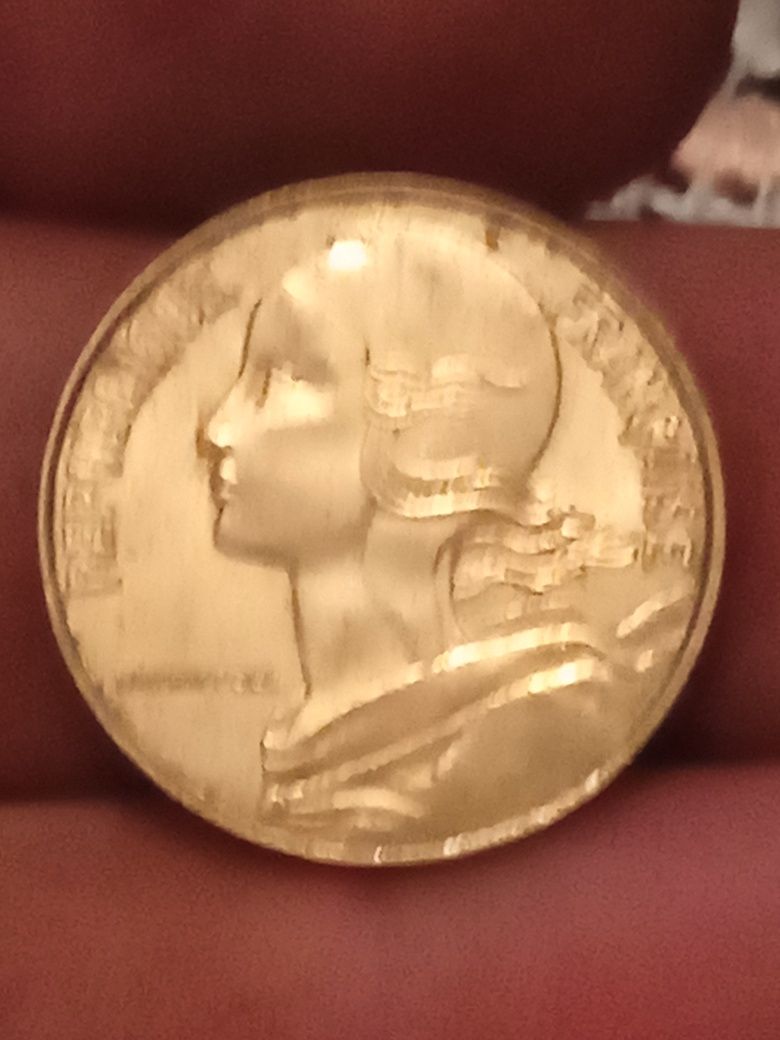 Монета 20 сентіма перевертиш.