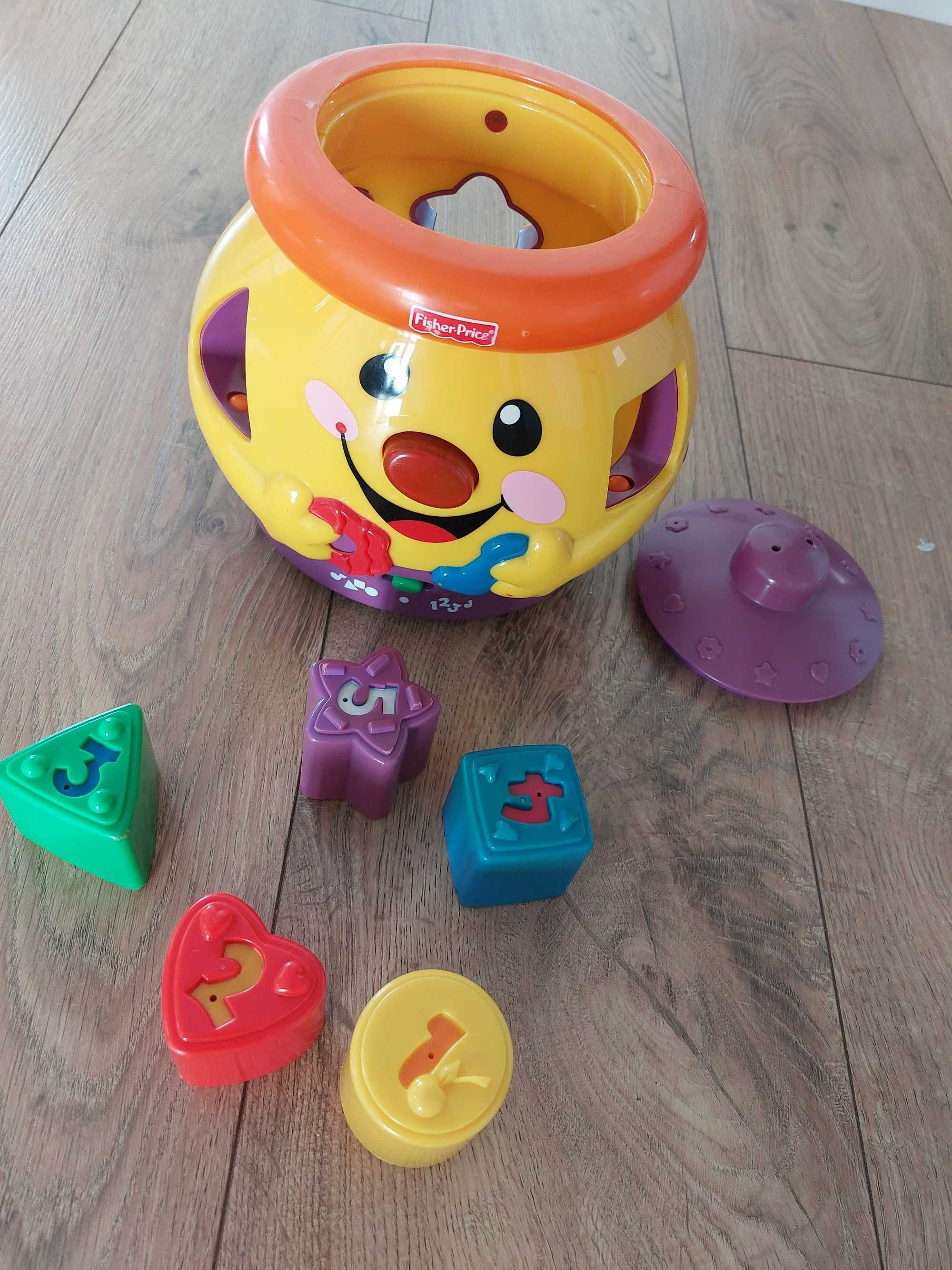 Muzyczny garnuszek edukacyjny fisher price