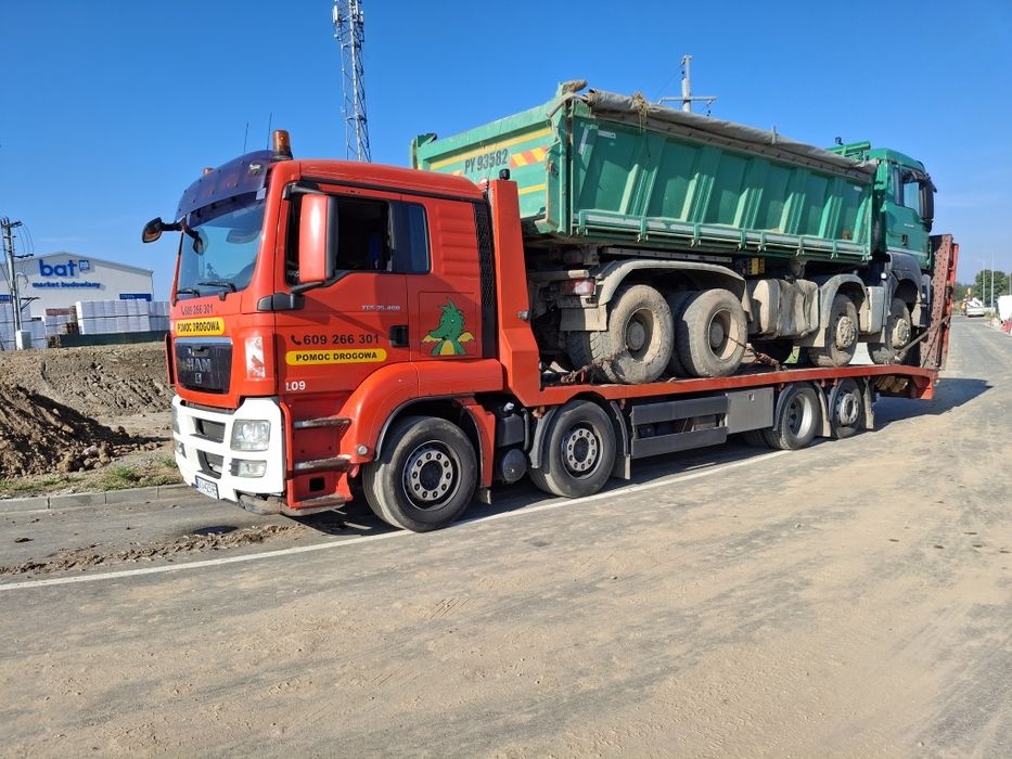 Laweta transport pomoc drogowa koparka ładowarka wozek widłowy bus