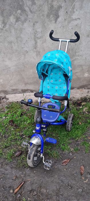 дитяча машина на педалях та три колесний велосипед