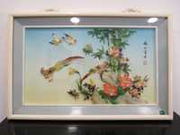 Quadro japonês com pássaros e elementos florais.