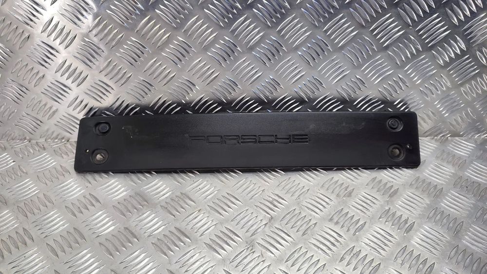 PORSCHE CAYENNE II 10-17R PODKLADKA PODSTAWA TABLICY REJESTRACYJNEJ PRZOD 7P5807287
