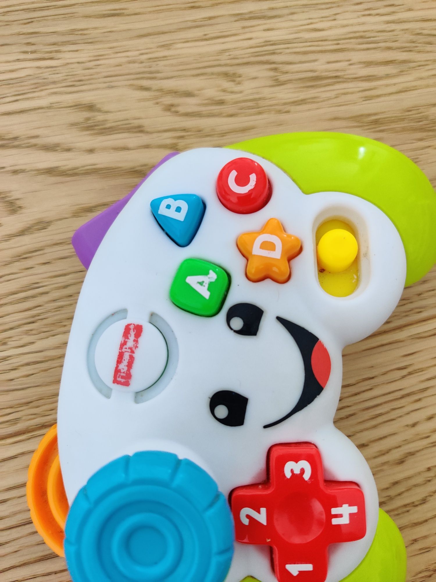 Zabawki Fisher Price pchacz z kulkami pad konsola interaktywna