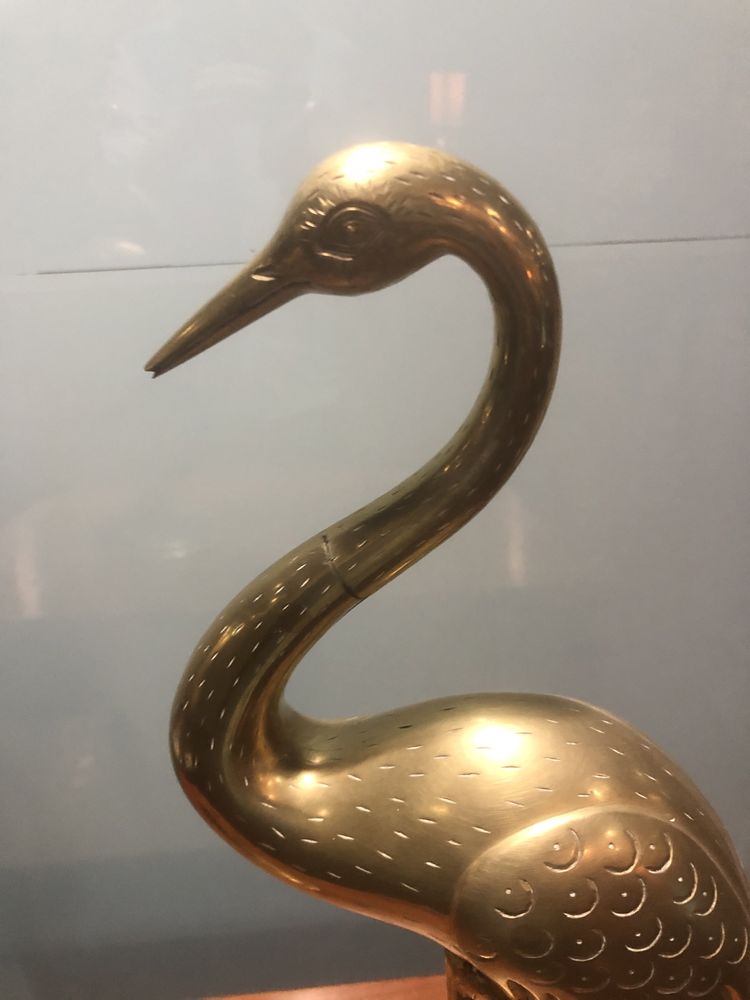 Par de garcas e latao