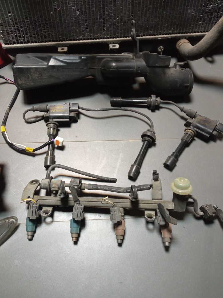 Mazda Premacy 1.8 alternator chłodnica lampy cewka roleta kierunki