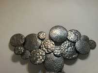 Peça decorativa em metal