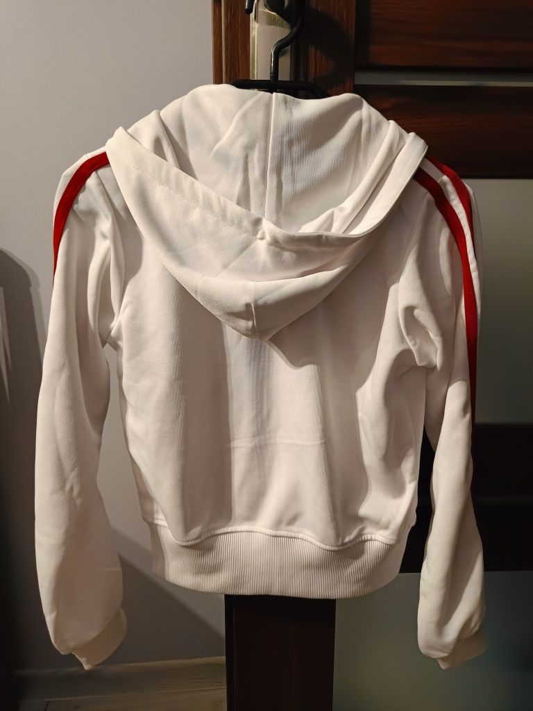 Bluza damska rozpinana z kapturem firmy La coq sportif.