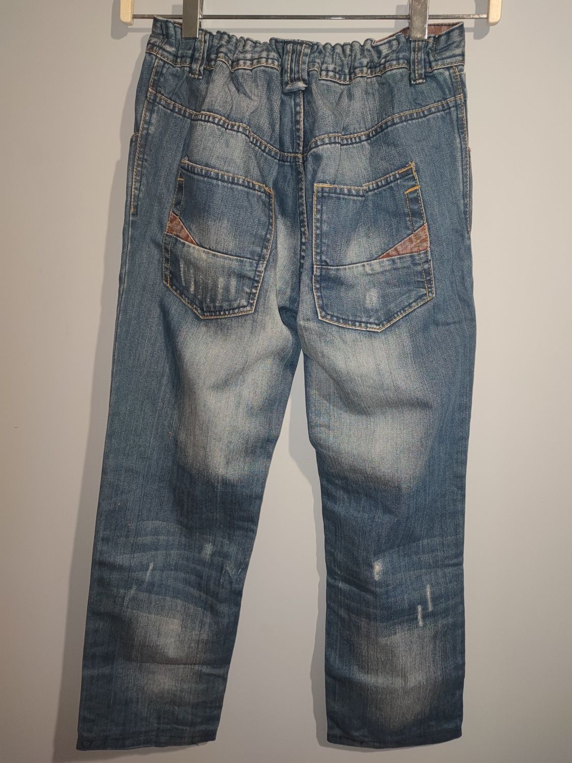 Spodnie jeansy dla chłopca z przetarciami 152
