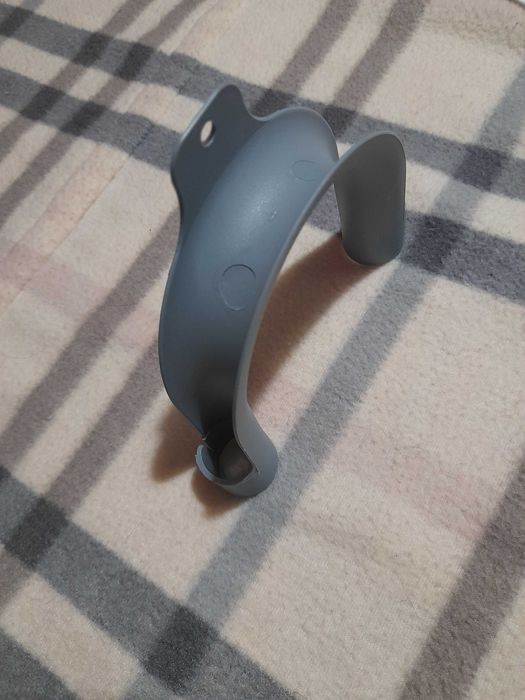 Фіксатор зливного шлангу пральної машини