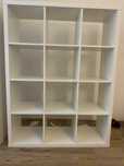 Regał Ikea, szer.: 100 cm, wys.: 140 cm, gł.: 36 cm.