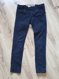Spodnie rurki gumowane jeansy czarne 134