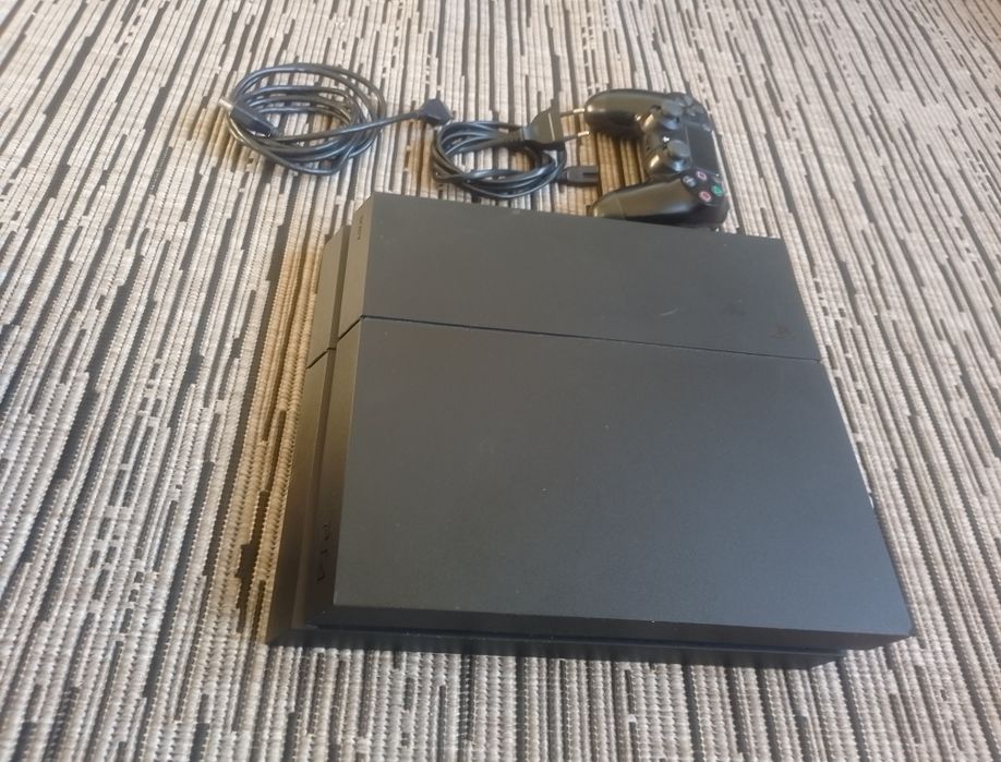 Ps4 1000 GB com comando original nova com fifa jogo
C